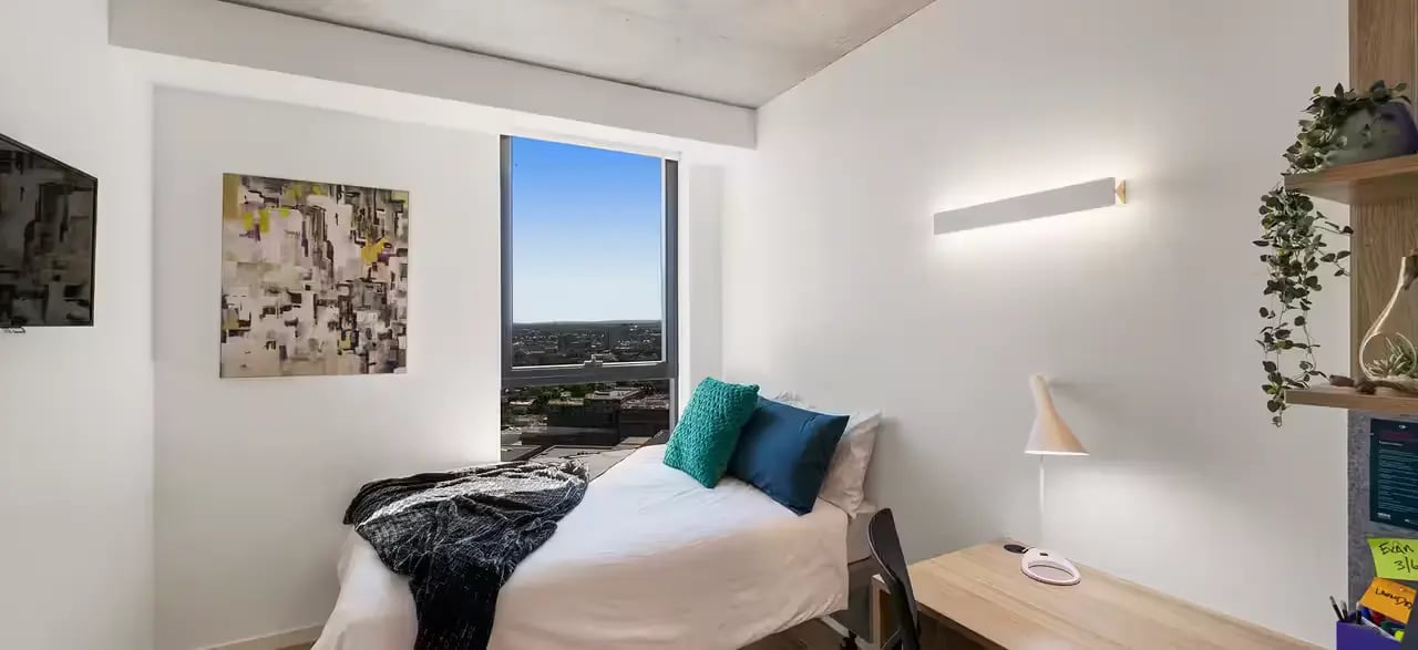 Bed desk painting and window bedroom at Scape Peel in Melbourne Student Accommodation