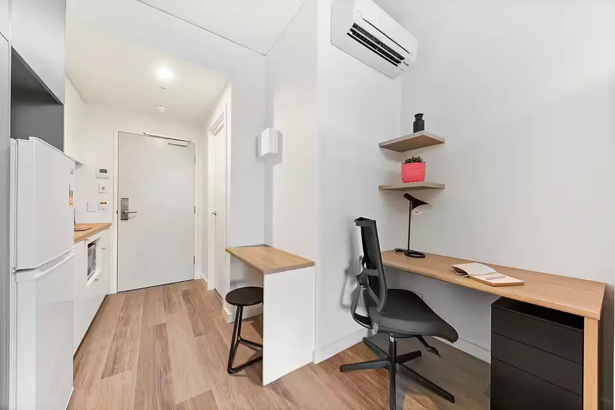 Fridge desk chair and shelves study area at Scape Waymouth in Adelaide Student Accommodation