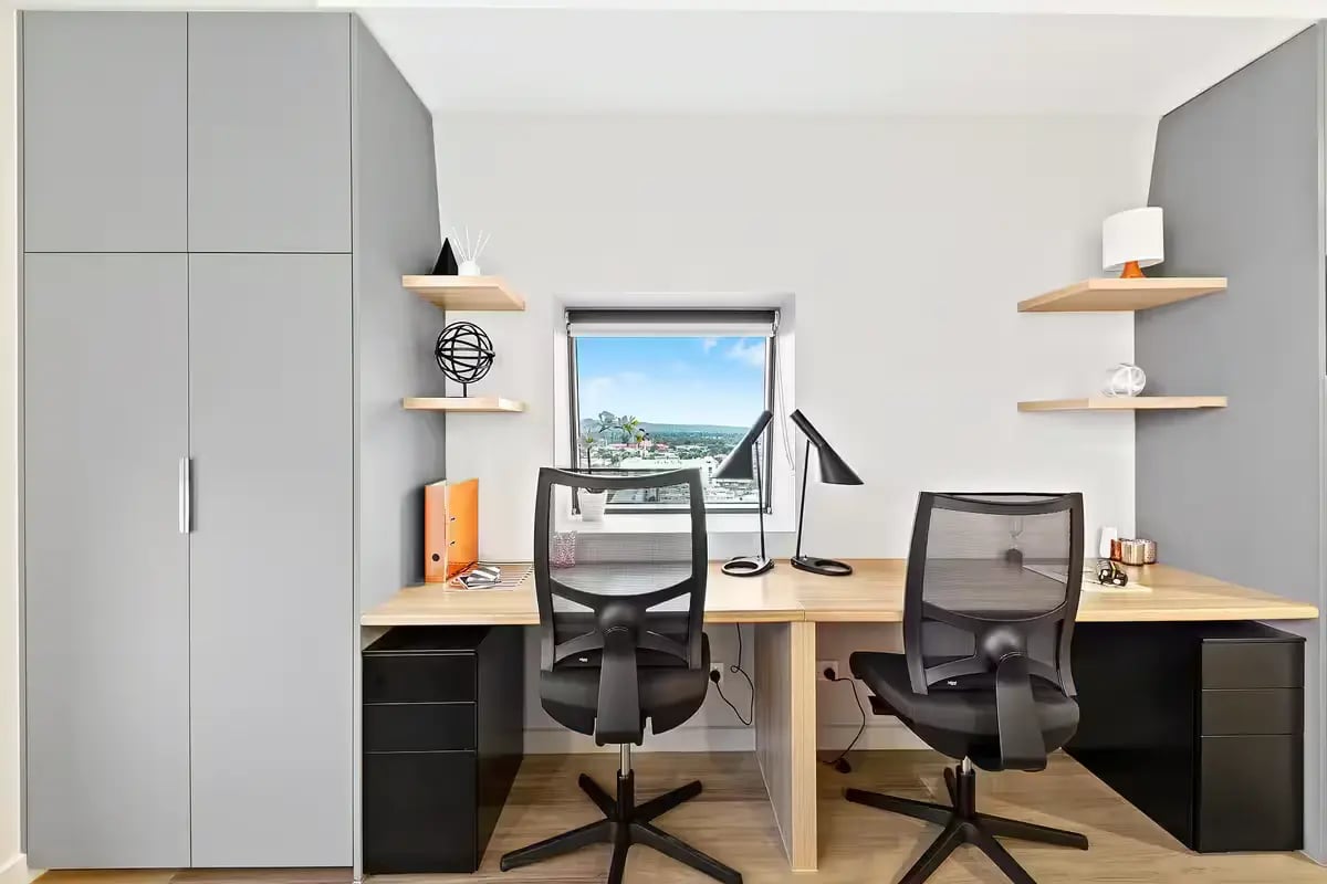 Two desks chairs lamps and window Study area at Scape Waymouth in Adelaide Student Accommodation