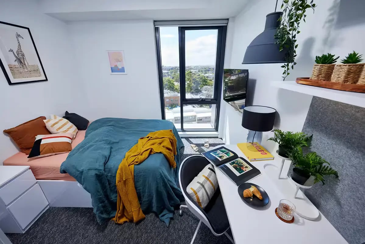 Bed desk lamp and plants bedroom study area at Scape Redfern in Sydney Student Accommodation