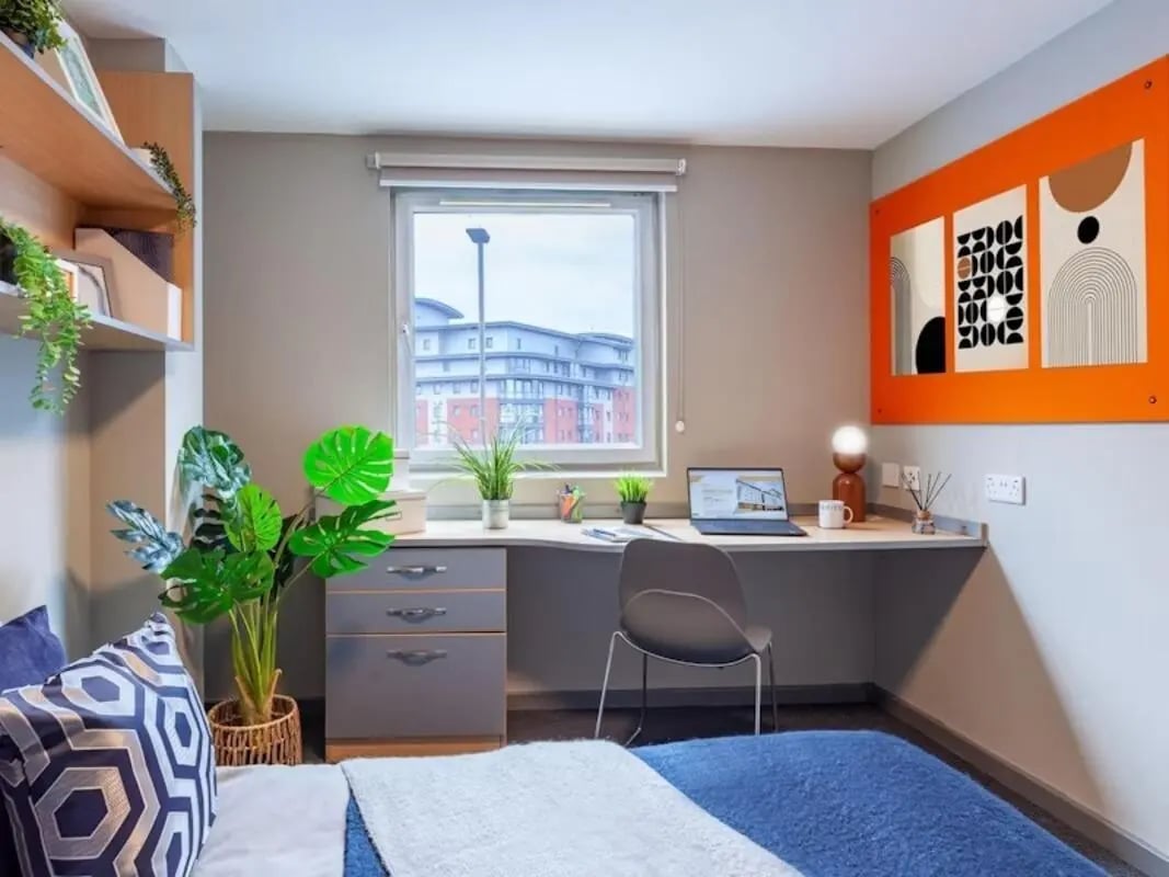 Desk with laptop plants and storage study area at Filbert Village in Leicester Student Accommodation
