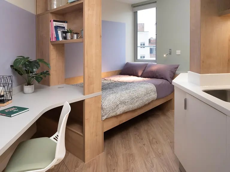 Bed desk and sink student accommodation studio at The Curve in London Student Accommodation