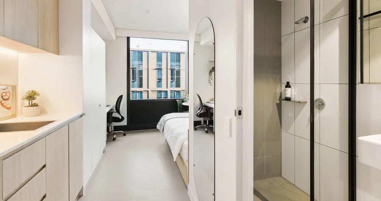 Modern kitchen corner bed desk and shower bathroom at Iglu Redfern in Sydney Student Accommodation