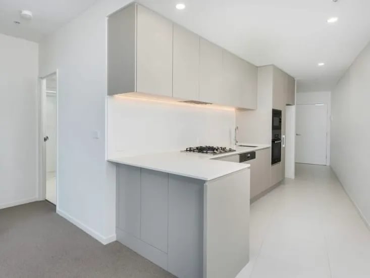 Modern kitchen with integrated appliances and island kitchen at BELONG Newcastle NSW in Newcastle Student Accommodation