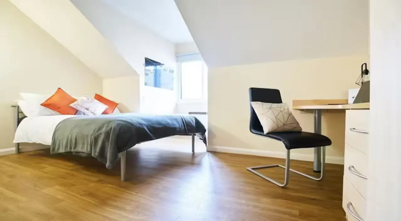 Bed desk chair with pillows study area at Heald Court in Manchester Student Accommodation