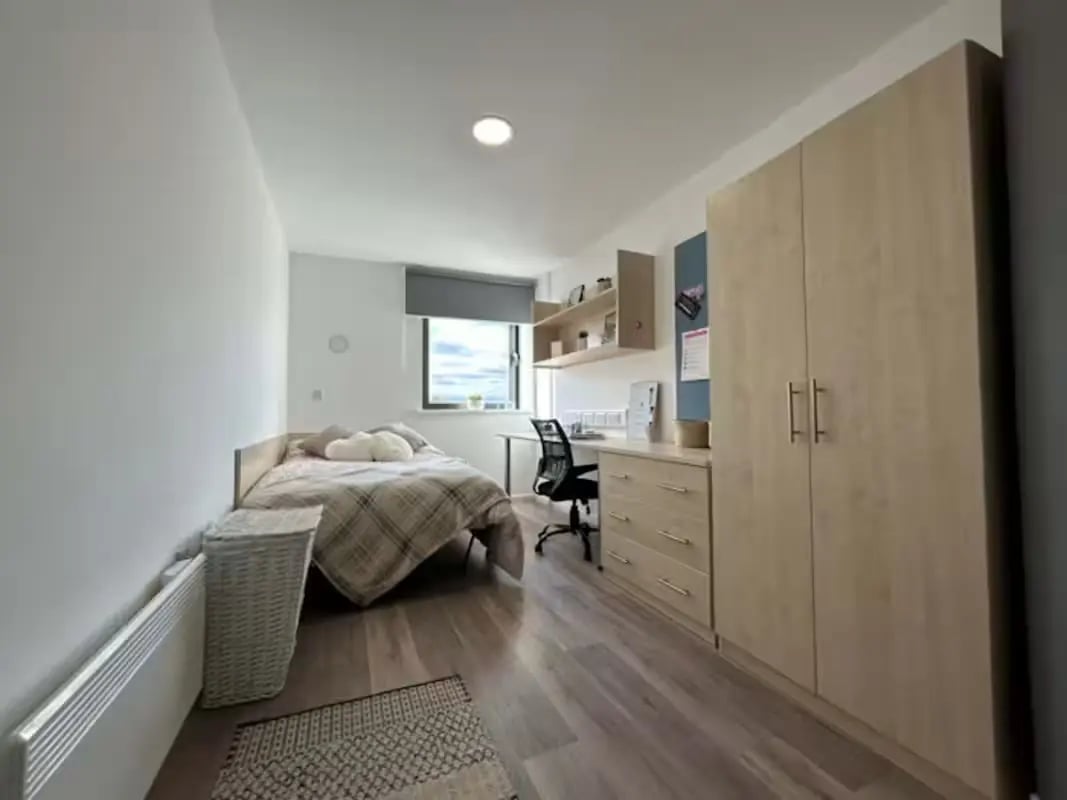 Bed desk wardrobe and storage unit bedroom at Trinity Square in Nottingham Student Accommodation