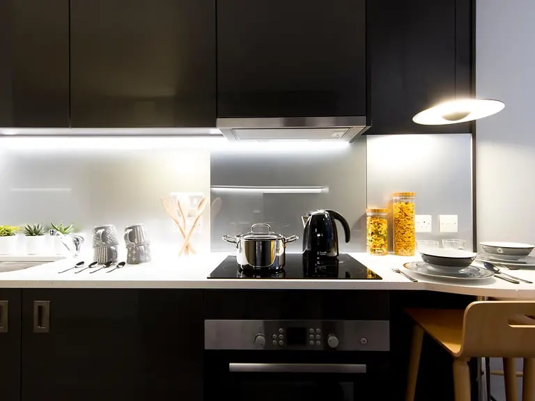 Kitchen counter with kettle pots and dishes Kitchen at Yugo Therese House in London Student Accommodation