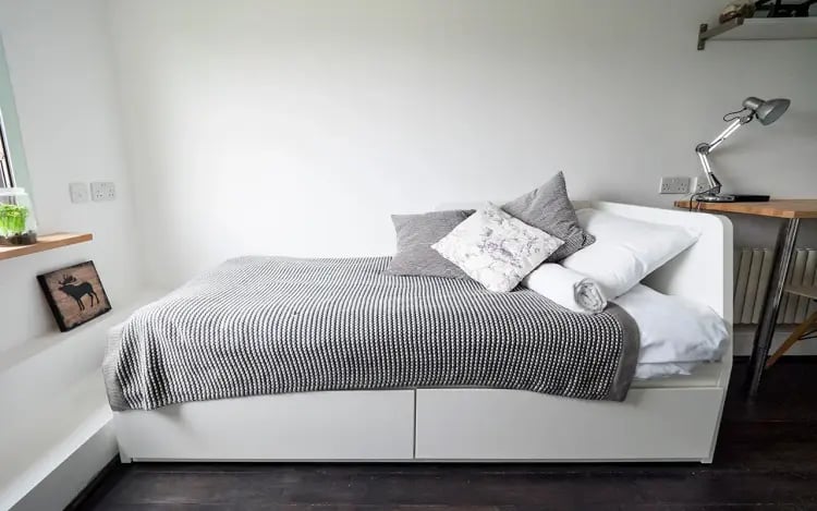 Bed with pillows blanket and desk Bedroom at The Stay Club - Camden in London Student Accommodation
