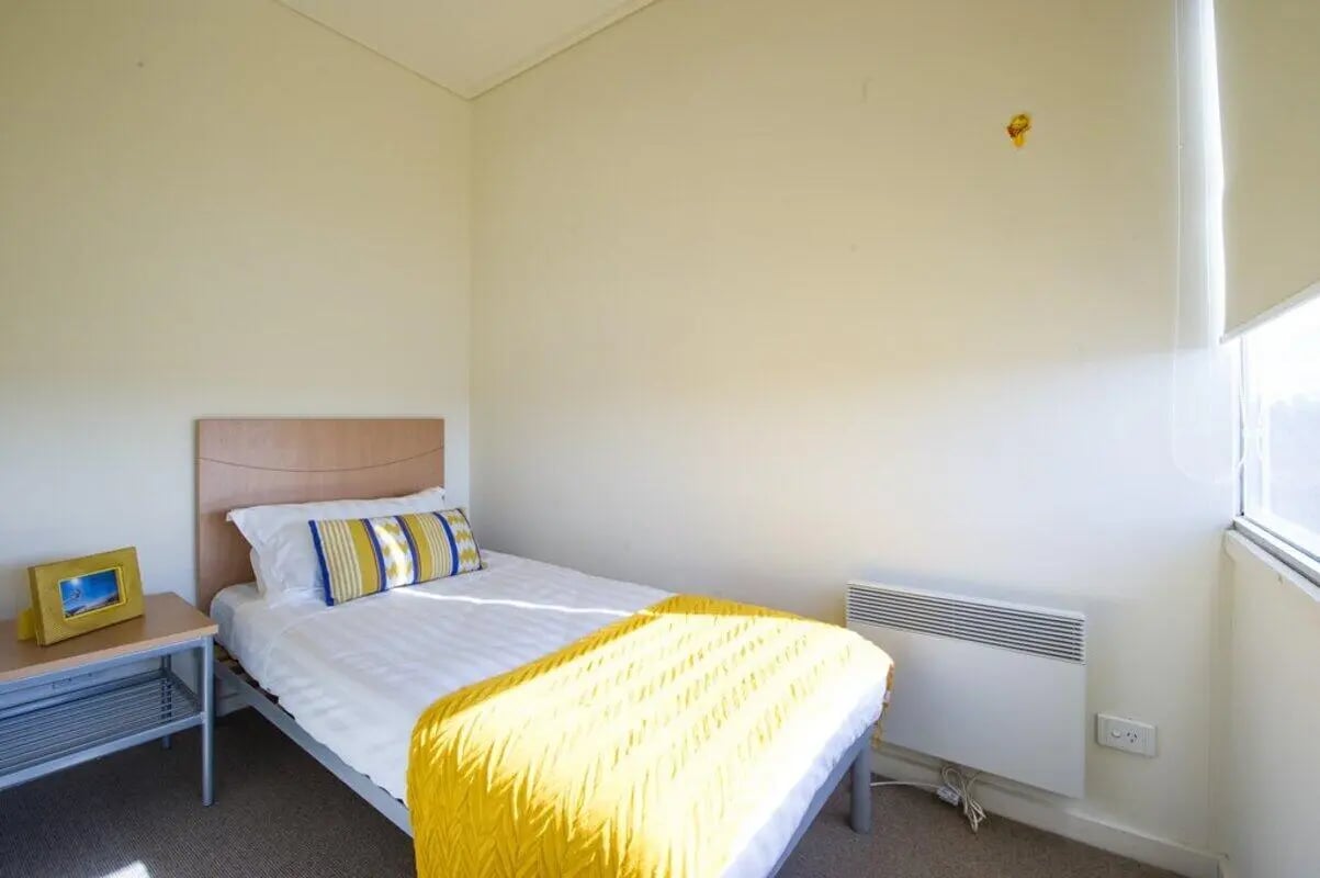 Bed side table and heater Bedroom at Student Living - 570 Lygon in Melbourne Student Accommodation