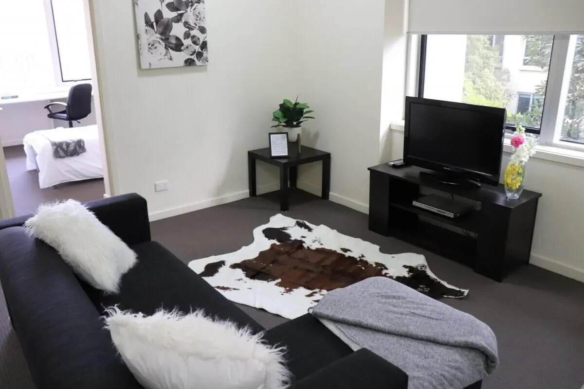 Sofa rug TV console with TV living room at Student Living - 570 Lygon in Melbourne Student Accommodation
