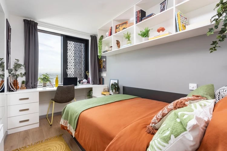 Bed desk and shelves with decor bedroom at Artisan Heights in Manchester Student Accommodation