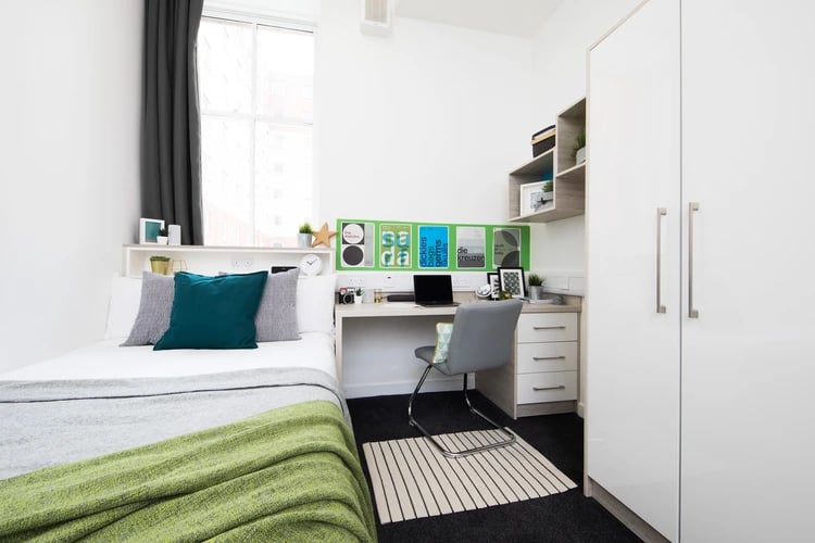 Bed desk chair laptop wardrobe bedroom at Merchant City House in Glasgow Student Accommodation