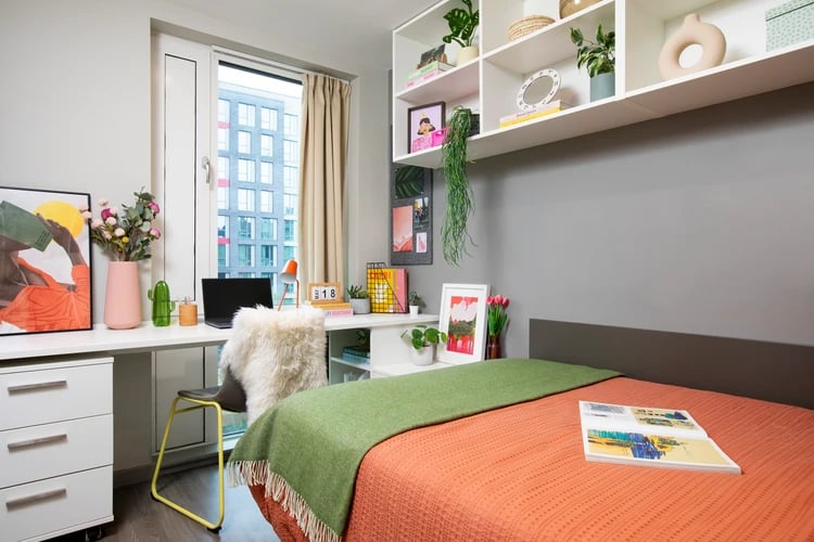 Bed desk chair shelves window art bedroom at Stapleton House in London Student Accommodation