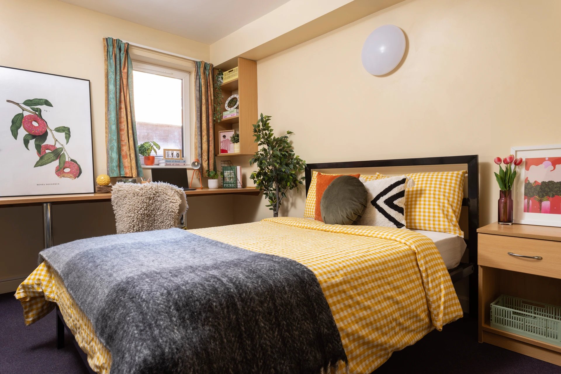 Bed with yellow gingham bedding and grey throw Bedroom at Moorfield in Liverpool Student Accommodation