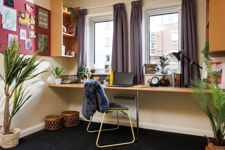 Desk with laptop and chair study area at Westhill Hall in Sheffield Student Accommodation