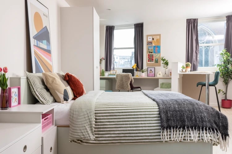 Bed desk pillows poster and artwork bedroom at Bromley Place in Nottingham Student Accommodation
