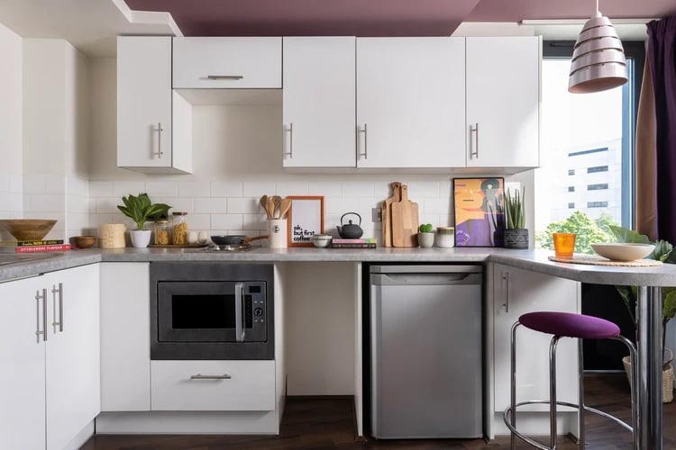 Microwave mini-fridge sink bar stool kitchen at Wellington St Plaza in Newcastle Upon Tyne Student Accommodation