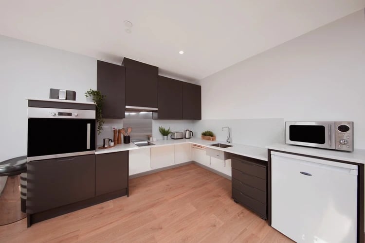 Modern kitchen with oven microwave fridge sink kitchen at White Rose View in Leeds Student Accommodation