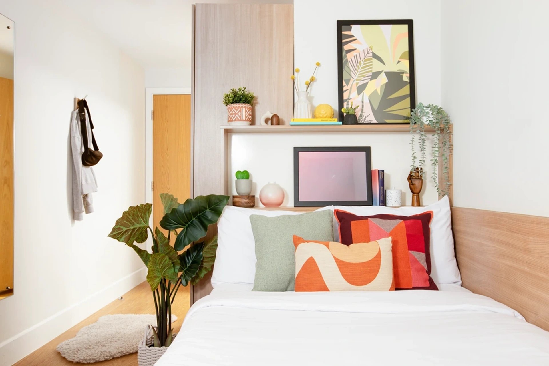 Bed with plants artwork and decor bedroom at Kelvin Court in Glasgow Student Accommodation