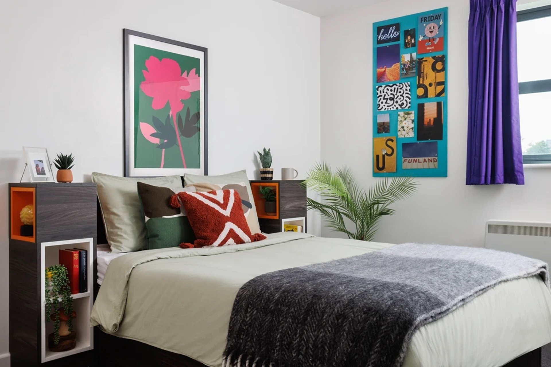 Bed with pillows artwork wall display bedroom at Quay Point in Newcastle Upon Tyne Student Accommodation