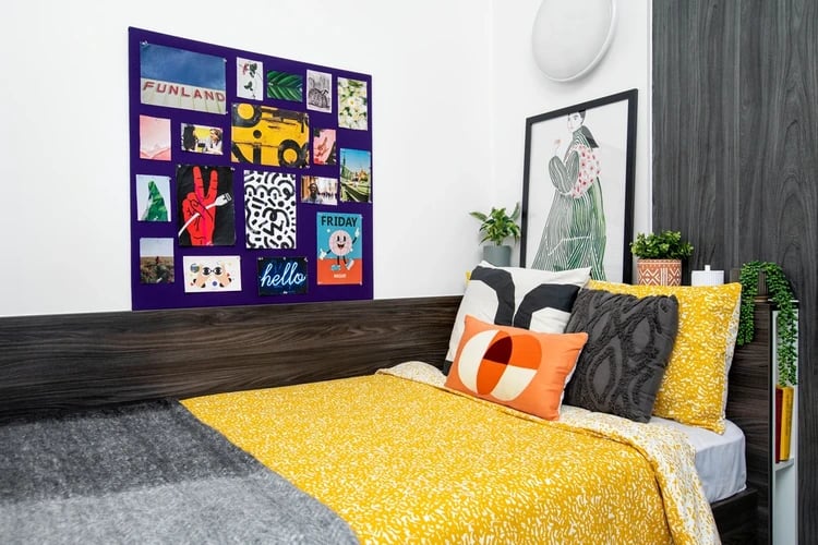 Yellow patterned bed purple collage art bedroom at Orion Point in Southampton Student Accommodation