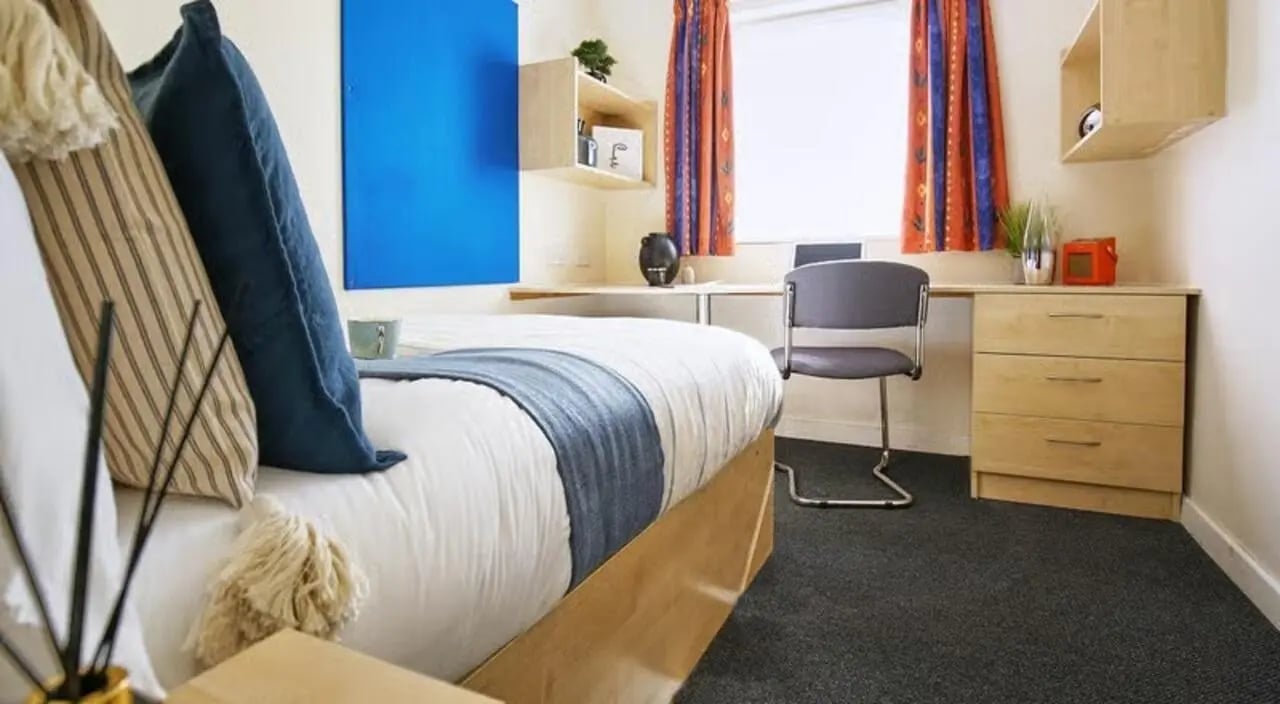 Bed desk chair and drawers student bedroom at College Court in Stoke-On-Trent Student Accommodation