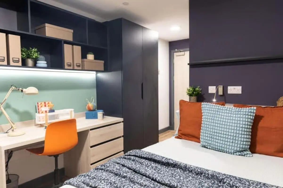 Desk chair lamp shelves and bed Bedroom at Tribeka in Leeds Student Accommodation