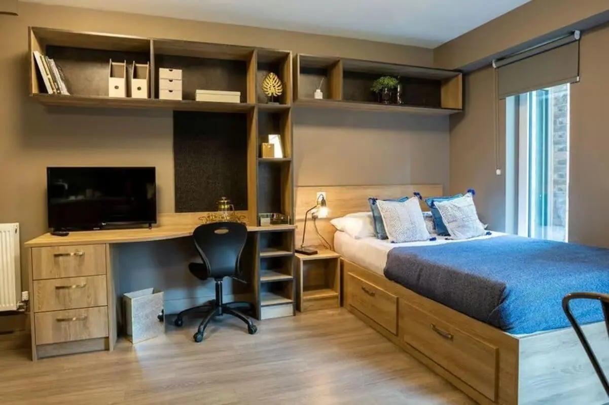 Desk television chair shelves bed bedroom at West Gate in Exeter Student Accommodation