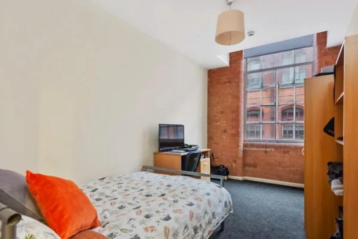 Bed desk chair and wardrobe student room at Bertrand Russell House in Nottingham Student Accommodation