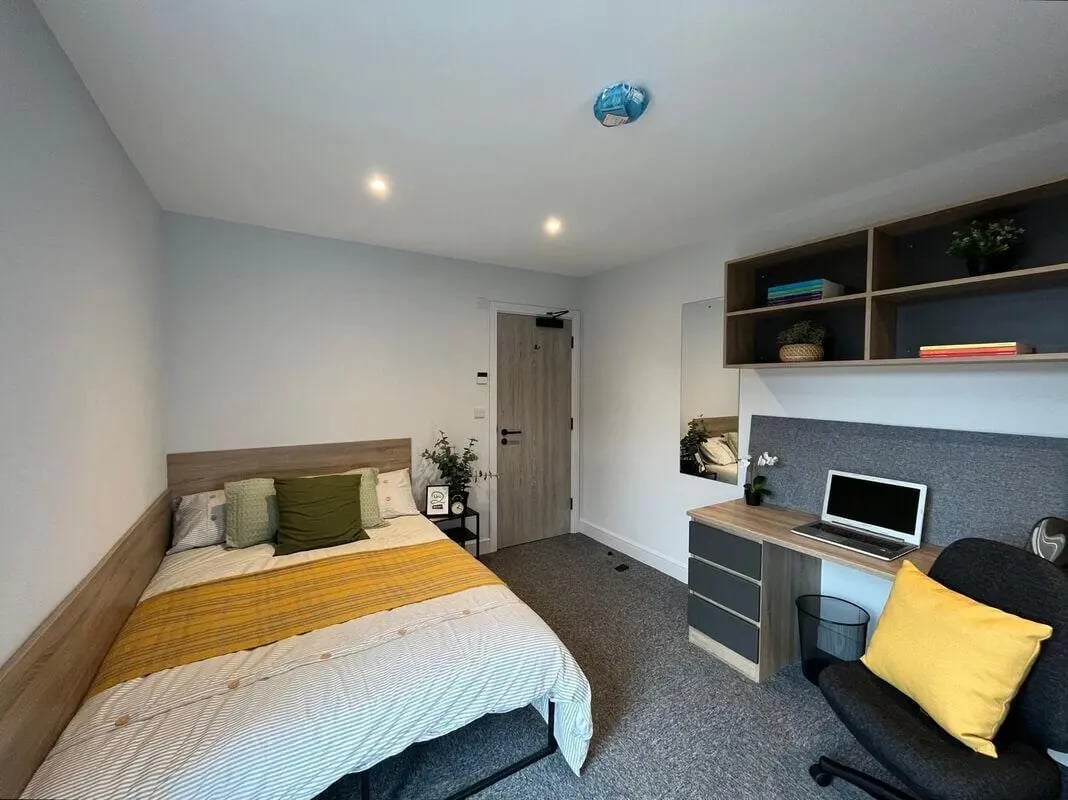 Bed desk and shelves bedroom at Commercial Point Nottingham in Nottingham Student Accommodation