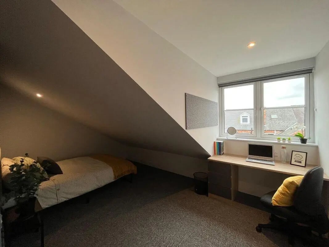 Bed desk chair and window bedroom at Commercial Point Nottingham in Nottingham Student Accommodation