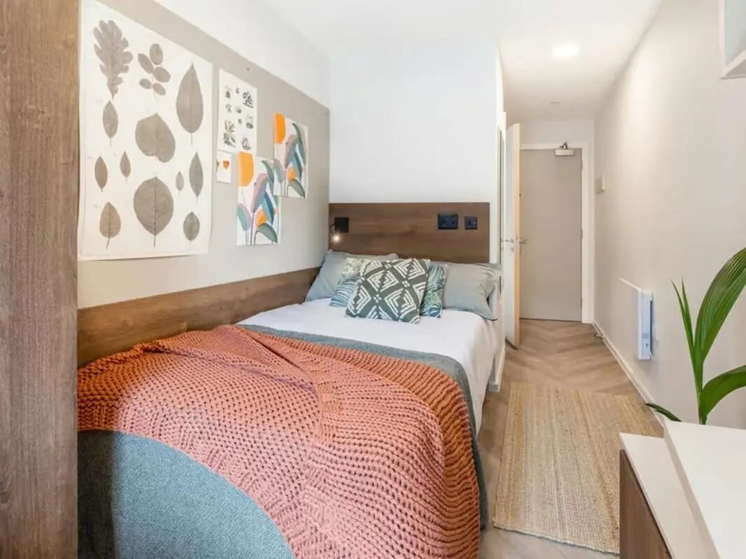 Bed with blankets art on wall bedroom at The Place in Nottingham Student Accommodation