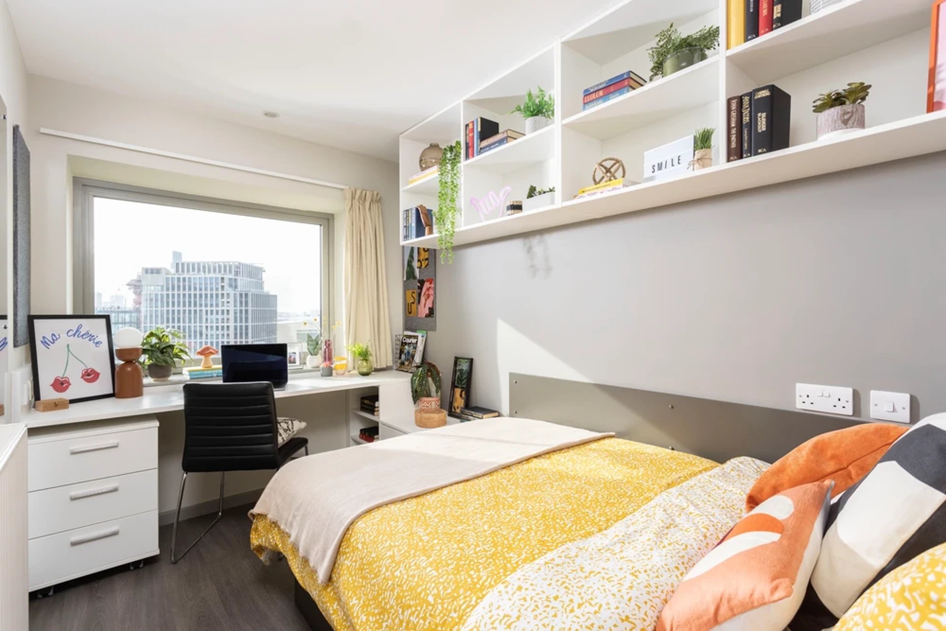 Desk with laptop drawers shelves bed bedroom at Stratford One in London Student Accommodation