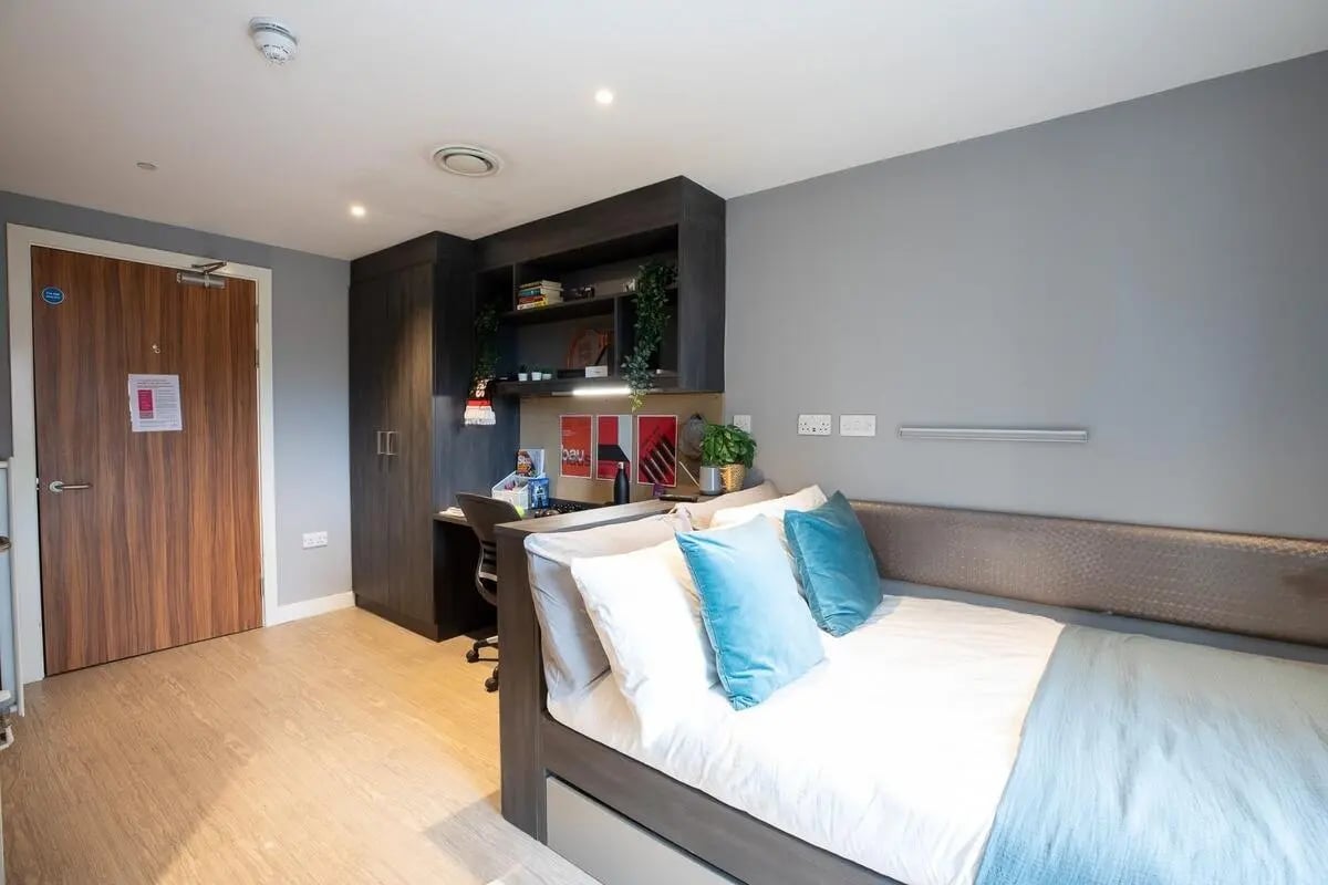 Bed desk and wardrobe modern student room at Collegiate Plummer House in Newcastle Upon Tyne Student Accommodation