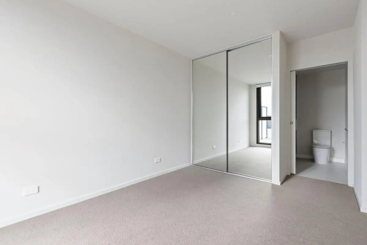 Mirrored wardrobe and toilet visible in room bathroom at Realm Caulfield in Melbourne Student Accommodation