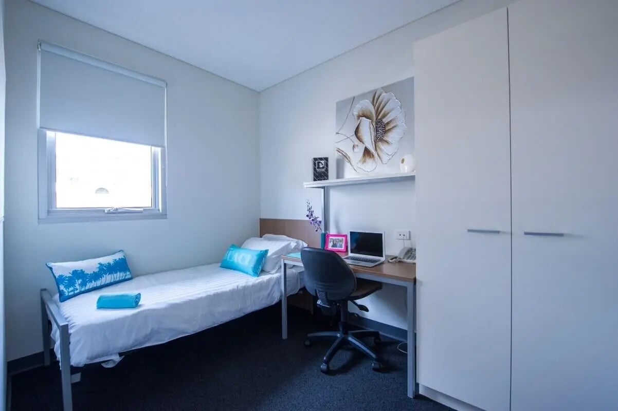 Bed desk laptop artwork closet bedroom at UniLodge @ Metro Adelaide in Adelaide Student Accommodation