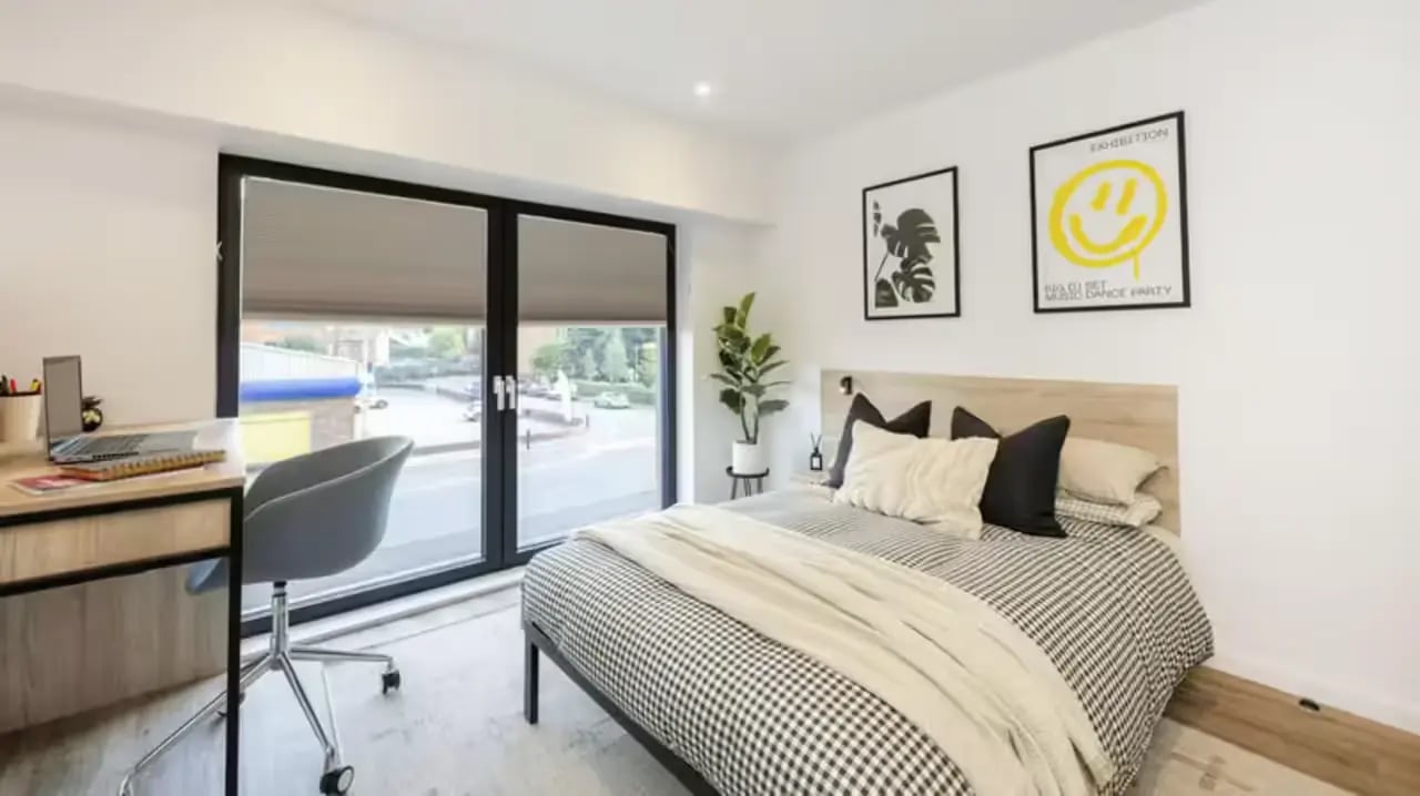 Desk chair bed with large window bedroom at The Fabric Works in Leeds Student Accommodation