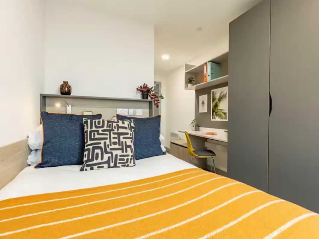 Bed desk shelves and wardrobe bedroom at Onyx Birmingham in Birmingham Student Accommodation