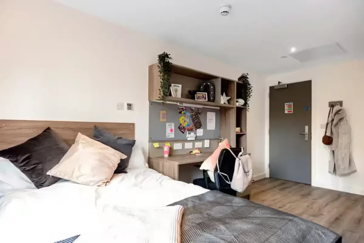 Bed desk shelving and door bedroom at Howard Gardens in Cardiff Student Accommodation
