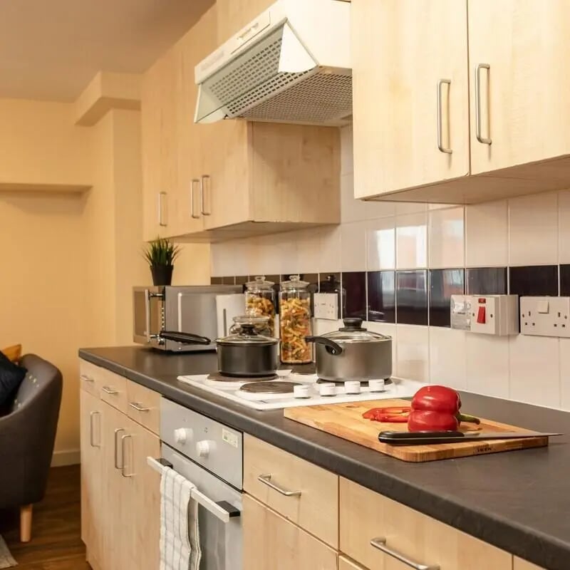 Cabinets stovetop pots cutting board pepper kitchen at Belgrave View in Birmingham Student Accommodation