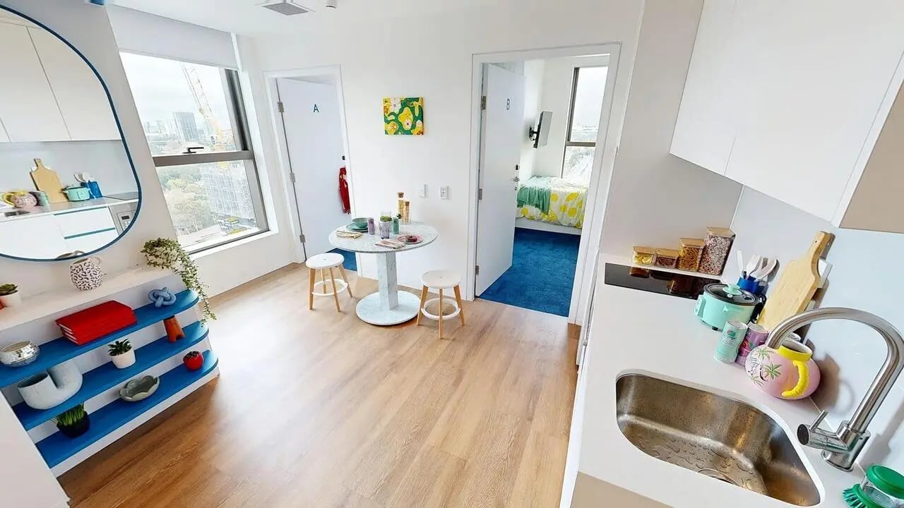 Kitchen dining area with bedroom view. at Scape Kensington in Sydney Student Accommodation