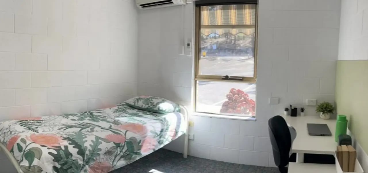 Bed desk air conditioner window bedroom at La Trobe University - Orde House in Melbourne Student Accommodation