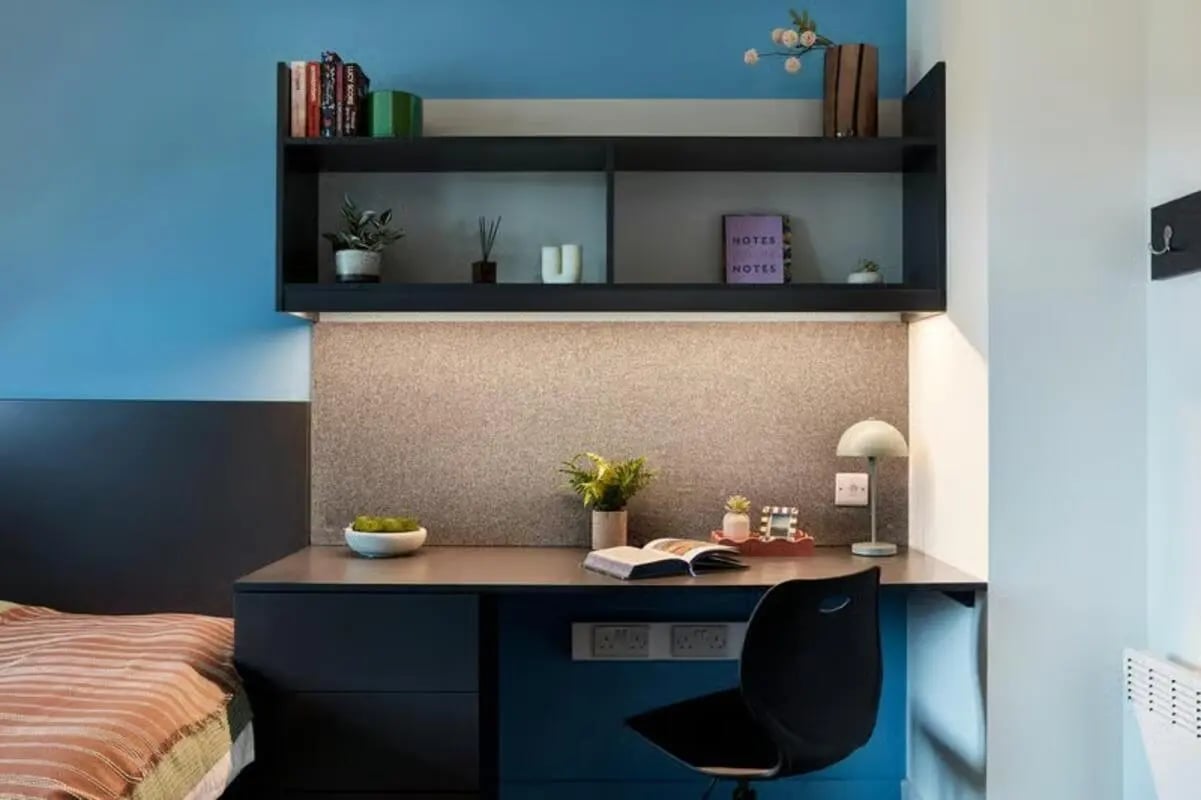 Desk with chair bookshelf and bed study area at Hollis Wharf in Bath Student Accommodation