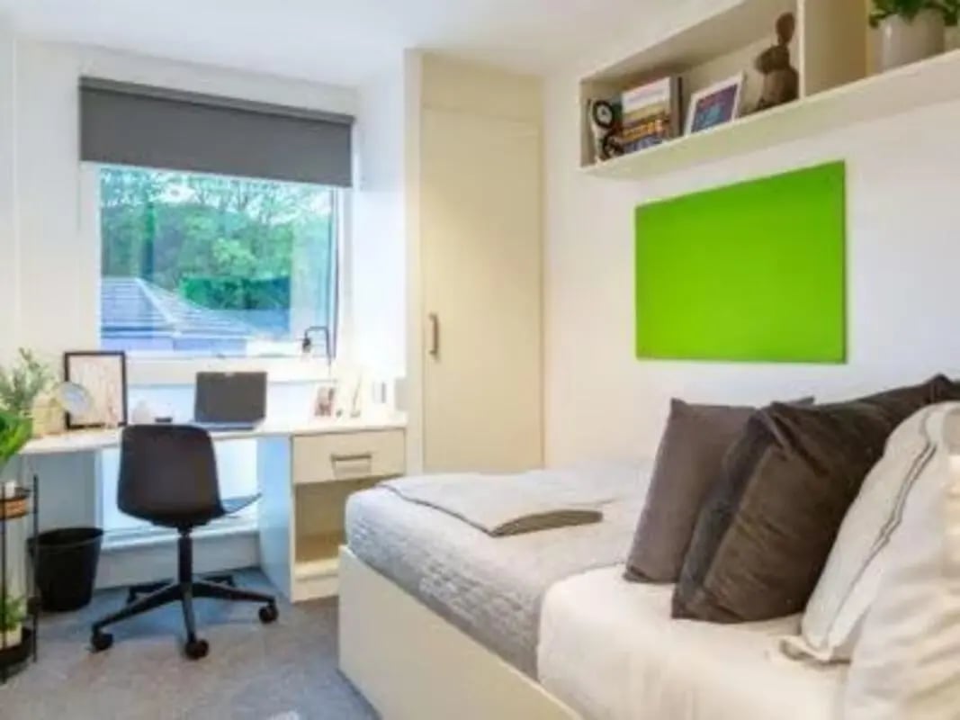 Bed desk chair laptop and shelves bedroom at Hollingbury House in Brighton Student Accommodation