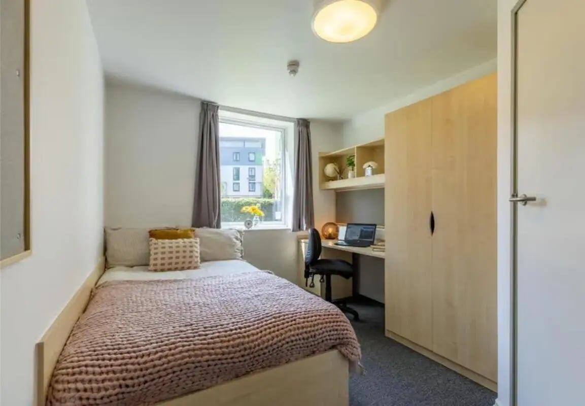 Bed desk chair wardrobe study area at The Green in Bradford Student Accommodation