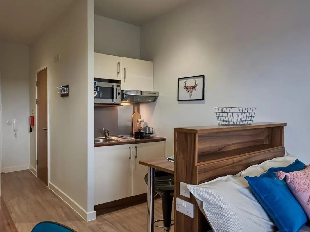 Compact kitchen with microwave sink and bed living room at Central Studios Reading in Reading Student Accommodation