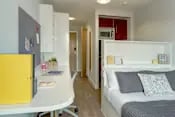 Desk bed wardrobe microwave kitchen living room at Glassyard Building in London Student Accommodation