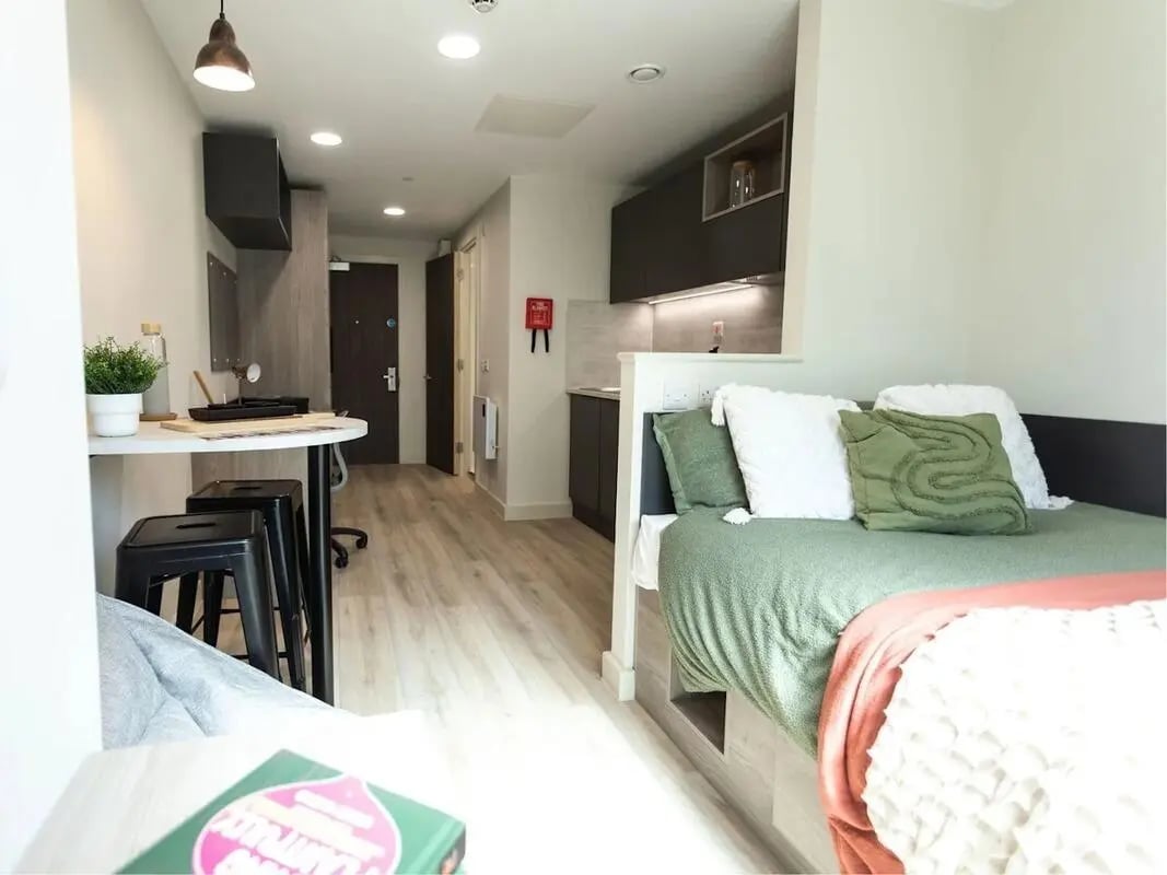 Bed desk kitchen area and hallway studio apartment at Stanley Studios - Portsmouth in Portsmouth Student Accommodation