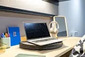 Laptop headphones mirror study desk area at Biscuit Factory in Belfast Student Accommodation