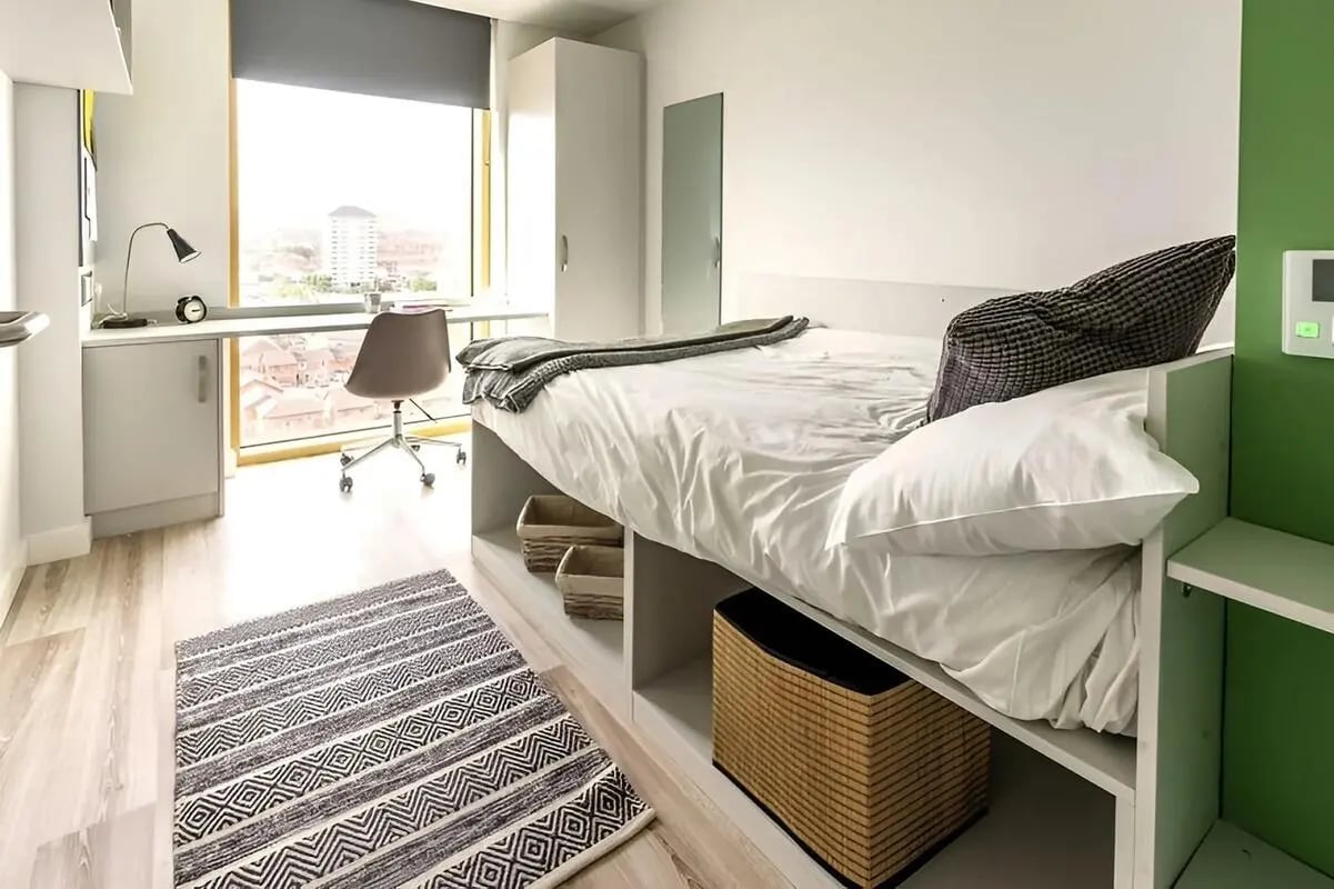 Bed desk chair rug storage baskets bedroom at 123 York Street in Belfast Student Accommodation